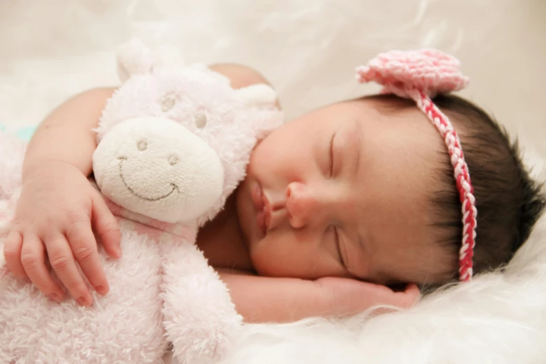 a baby sleeping next to a stuffed animal, pexels contest winner, pink headband, animation, profile pic, highly polished