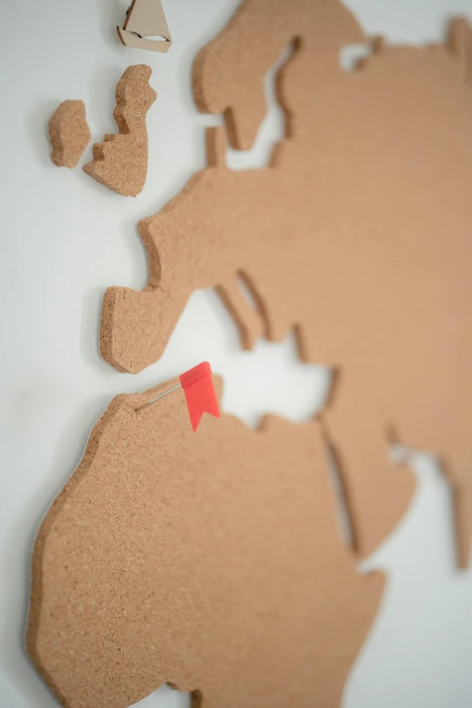 a close up of a map of the world, terracotta, diecut, brexit, close up shot from the side