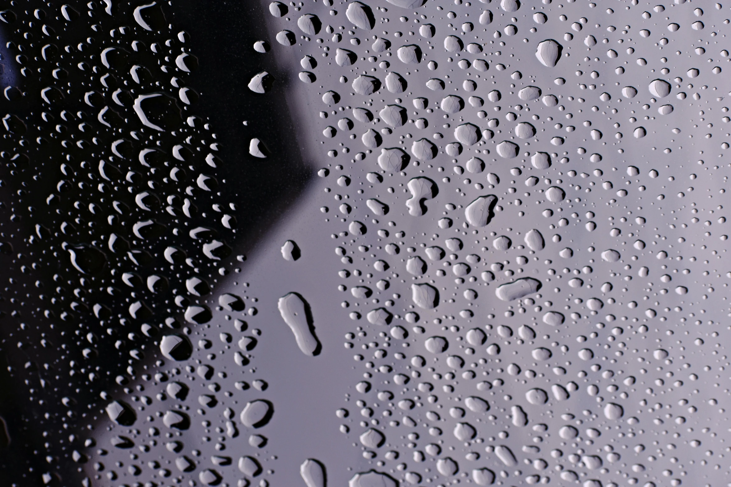 a close up of water droplets on a window, an album cover, by Jan Rustem, unsplash, photorealism, made of liquid purple metal, grey, taken in the late 2000s, panel of black