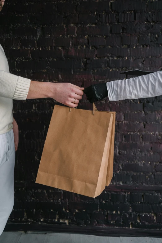 a man handing a paper bag to another man, pexels contest winner, renaissance, fencing, non-binary, white sleeves, very dark background