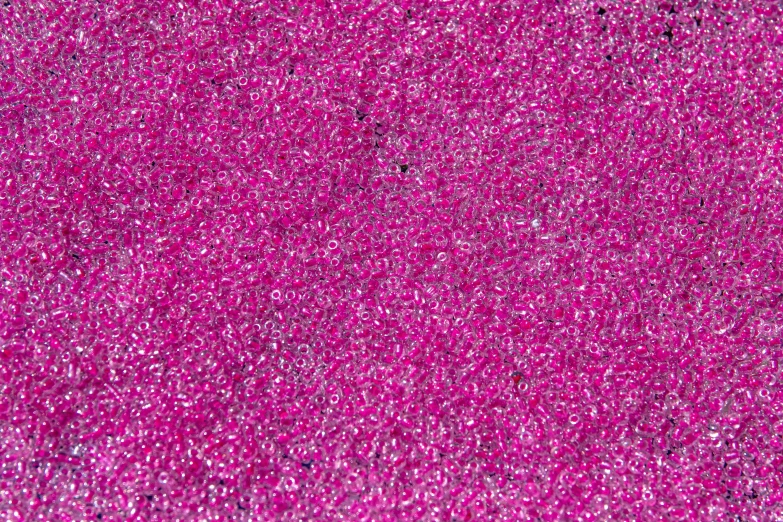 a close up of a pink glitter background, by Howardena Pindell, kinetic pointillism, vivid ultraviolet colors, dubai, 5 mm, magenta colours