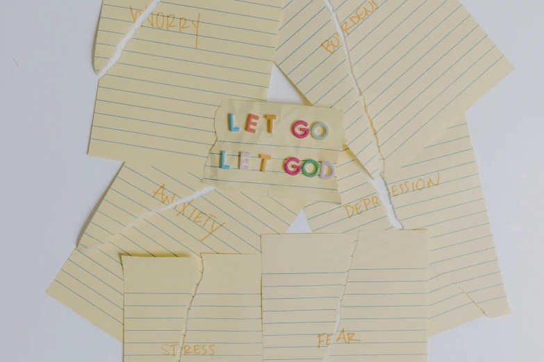 a pile of sticky notes sitting on top of each other, an album cover, by Carey Morris, pexels contest winner, conceptual art, then leave it to god, with some hand written letters, of letting go, paper cut out