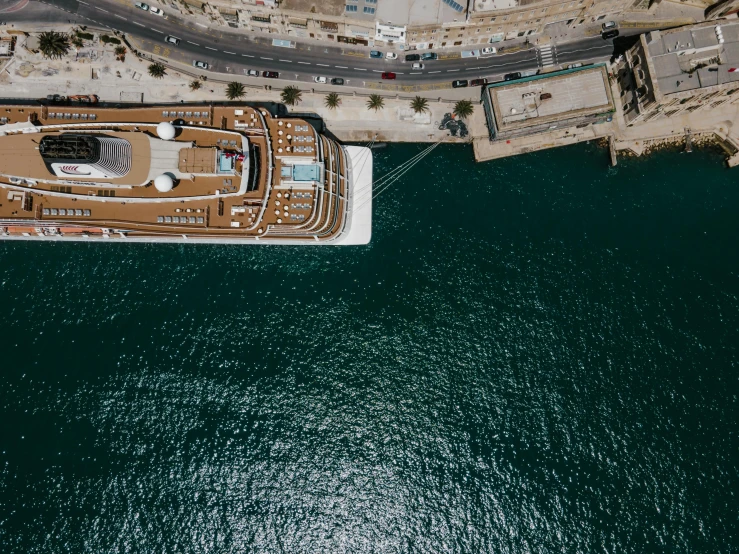 a large boat in the middle of a body of water, by Daniel Lieske, pexels contest winner, renaissance, aerial, port, portrait of royal princess, brown