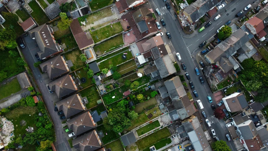 a bird's eye view of a residential area, inspired by Thomas Struth, pexels contest winner, turf roof, ground angle uhd 8 k, panels, looking sad