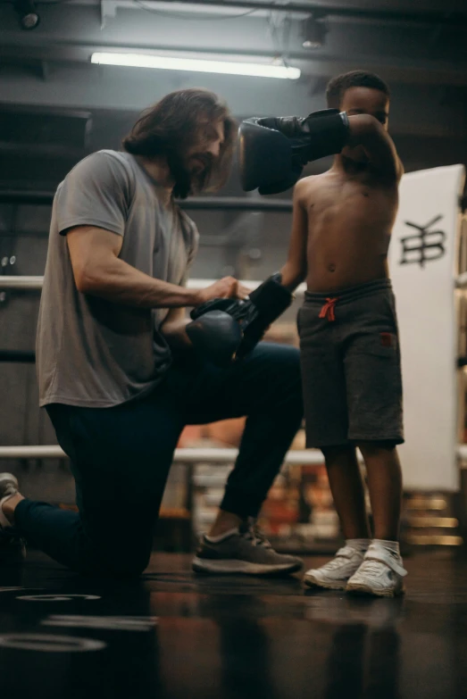 two men standing next to each other in a boxing ring, pexels contest winner, with a kid, jason momoa, working out, instagram photo