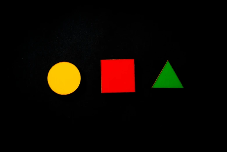 three different colored shapes on a black background, by Ottó Baditz, unsplash, de stijl, square, math, enamel, red and yellow light