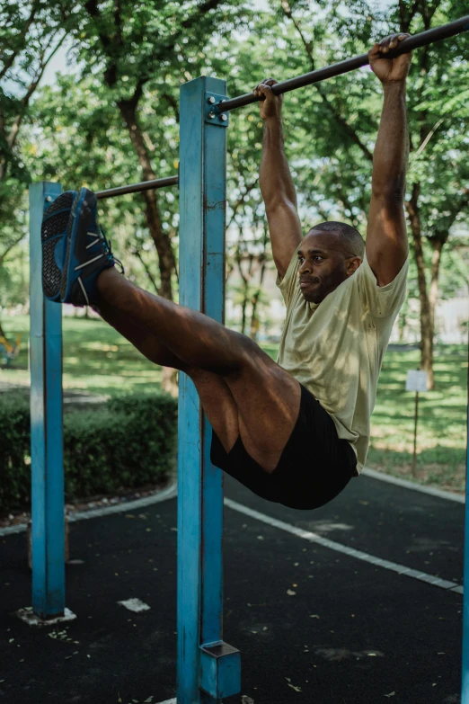 a man doing pull ups in a park, a portrait, pexels contest winner, square, leg high, kano), snapshot