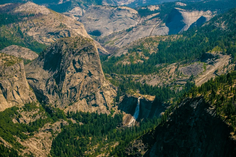 a view of the mountains from the top of a mountain, by Doug Wildey, pexels contest winner, hurufiyya, yosemite valley, with waterfalls, aerial view of an ancient land, slide show