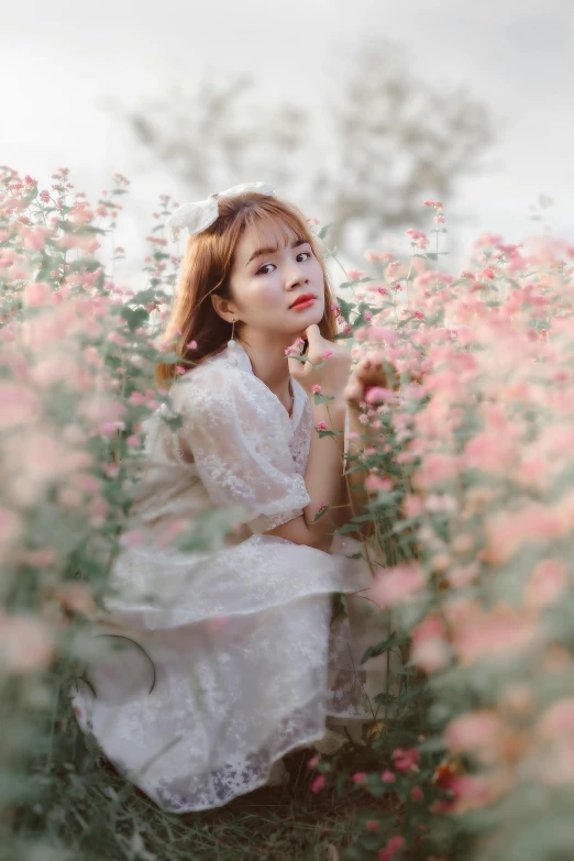 a woman sitting in a field of flowers, a picture, by Tan Ting-pho, pexels contest winner, visual art, white and pink, popular korean makeup, medium format. soft light, 5 0 0 px models