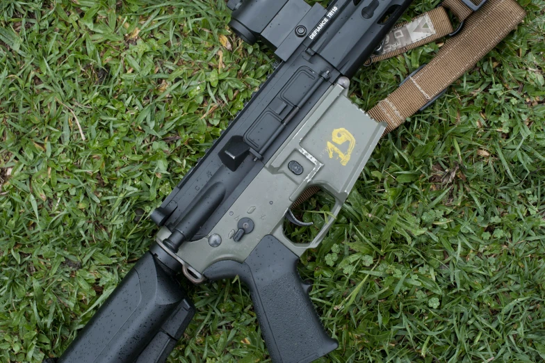 a gun that is laying in the grass, holding a rifle, profile image, full metal overlay, close up image