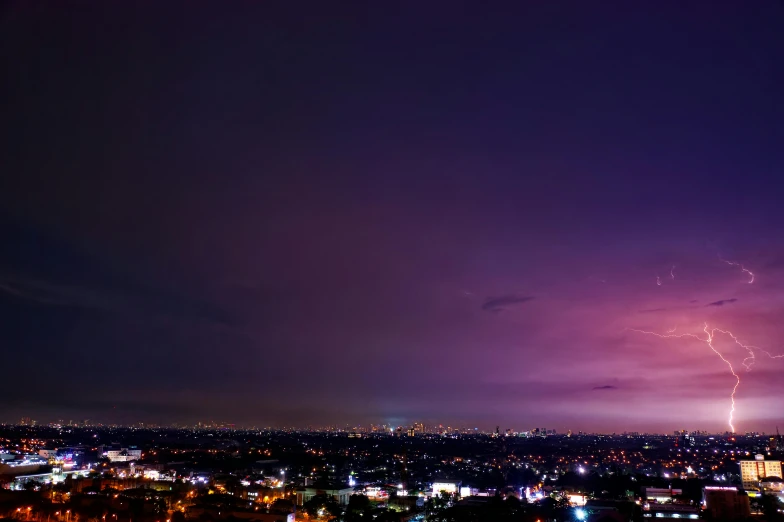 a lightning bolt over a city at night, a portrait, pexels contest winner, purple beautiful sky, panorama view of the sky, los angelos, purple and blue colored