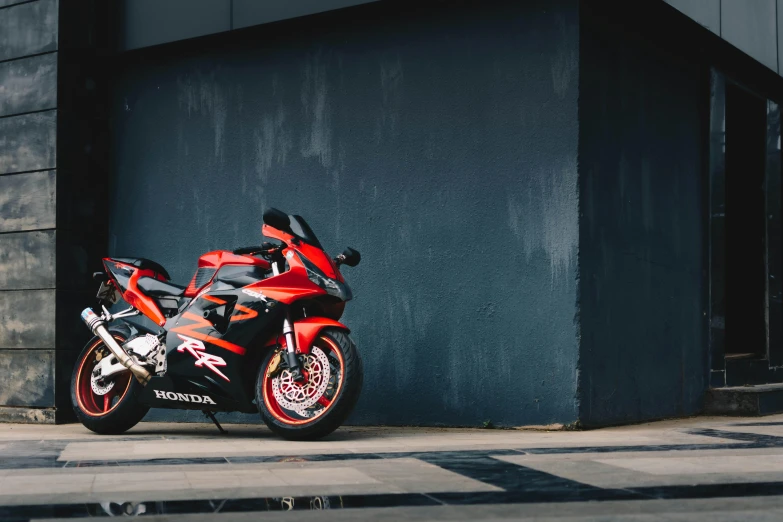 a red motorcycle parked in front of a building, pexels contest winner, honda rc 2 1 3, black and orange, full view of a sport car, 🚿🗝📝