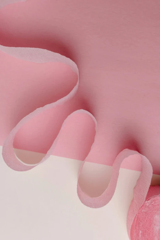 a close up of a pink object on a white surface, an abstract sculpture, inspired by Hsiao-Ron Cheng, trending on pexels, made of silk paper, detail, half image, wavy