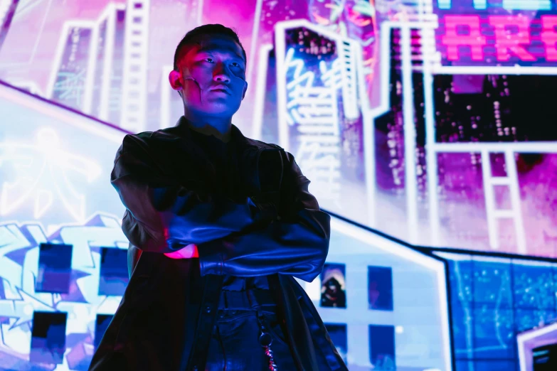 a man standing in front of a neon city, cyberpunk art, pexels contest winner, an epic non - binary model, cai xukun, outlive streetwear collection, wearing cyberpunk leather jacket