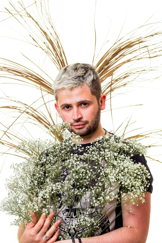 a man holding a bunch of baby's breath flowers, an album cover, inspired by Antoine Wiertz, wearing silver hair, vitaly bulgarov, scruffy looking, miro petrov