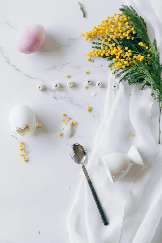 a close up of a plate of food on a table, easter, white marble interior photograph, spoon, craft
