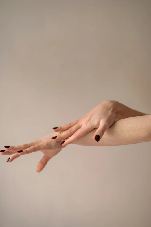 a woman's hand reaching out for something, by Gavin Hamilton, photorealism, smooth red skin, ad image, colour photograph, cream