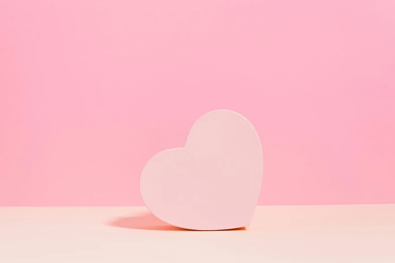 a white heart on a pink background, an album cover, inspired by Peter Alexander Hay, trending on unsplash, squishy, trending on dezeen, light blush, fan favorite