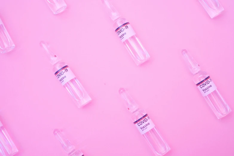 a lot of empty glass vials on a pink background, by Olivia Peguero, trending on pexels, eye bags, syringe, mid body, background is white