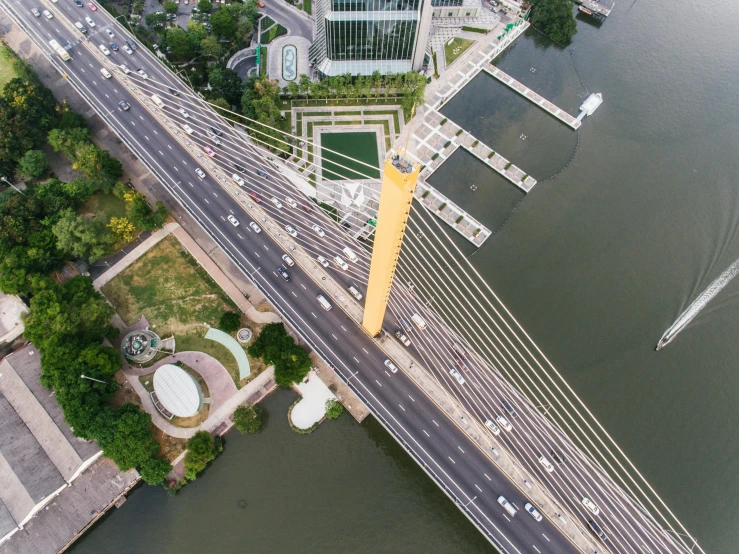 an aerial view of a bridge over a body of water, by Joze Ciuha, bangkok, gigantic tower, view from the side, less detailing