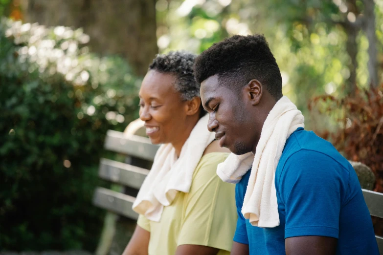 a couple of people that are sitting on a bench, wearing a towel, profile image, health supporter, dark-skinned