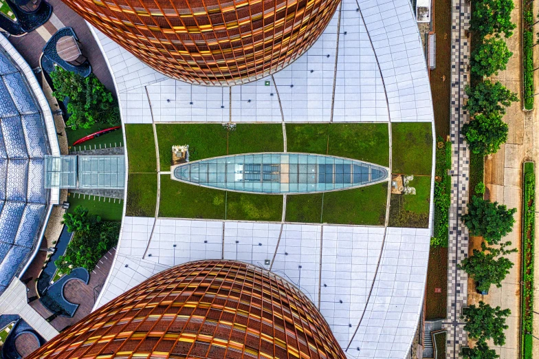 an aerial view of a building with a fountain, inspired by Zha Shibiao, pexels contest winner, rusty metal towers, panoramic shot, hangzhou, pov photo