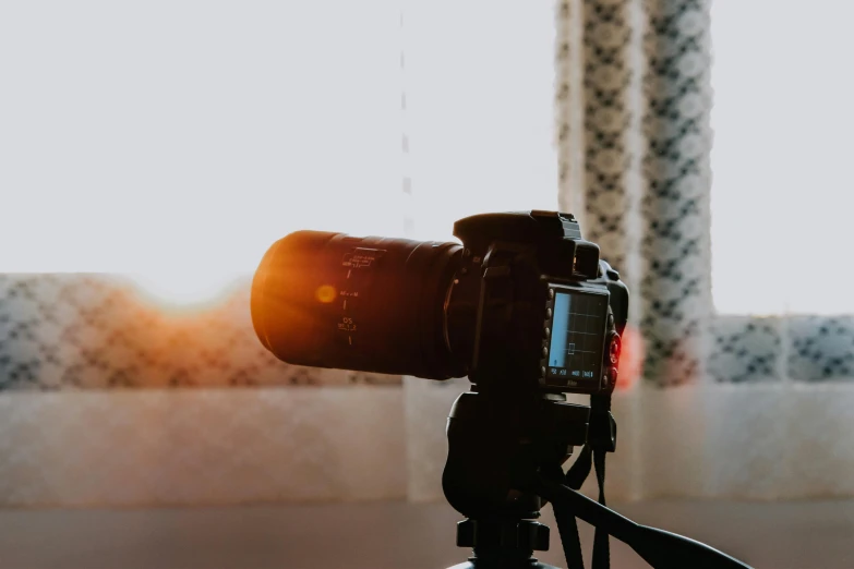 a close up of a camera on a tripod, unsplash, video art, sunlight beaming down, home photography portrait, youtube thumbnail, bright daylight indoor photo