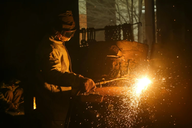 a man that is standing next to a fire, by Joe Stefanelli, pexels contest winner, welding torches for arms, avatar image, cast iron material, foreground