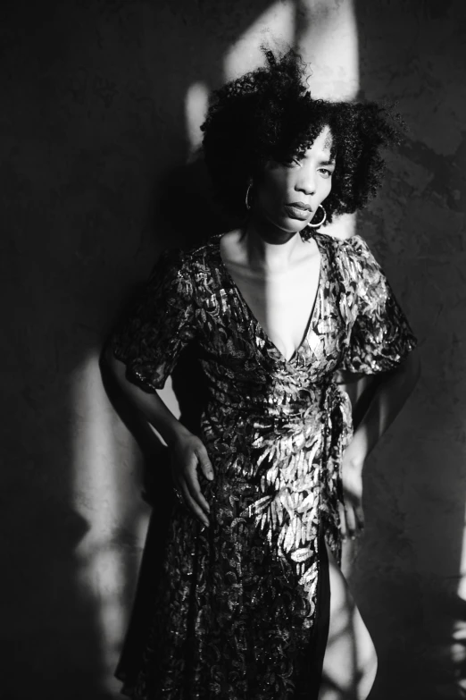 a black and white photo of a woman in a dress, an album cover, kezie demessance, ((portrait)), lizard king / queen forgiveing, high contrast dappled lighting