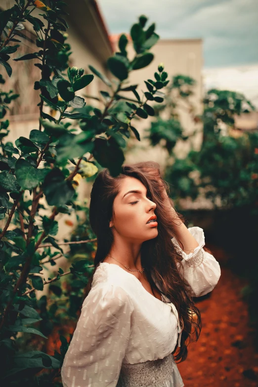 a woman in a white dress standing next to a tree, a picture, inspired by Elsa Bleda, trending on pexels, renaissance, madison beer girl portrait, covered in plants, 15081959 21121991 01012000 4k, brown colored long hair