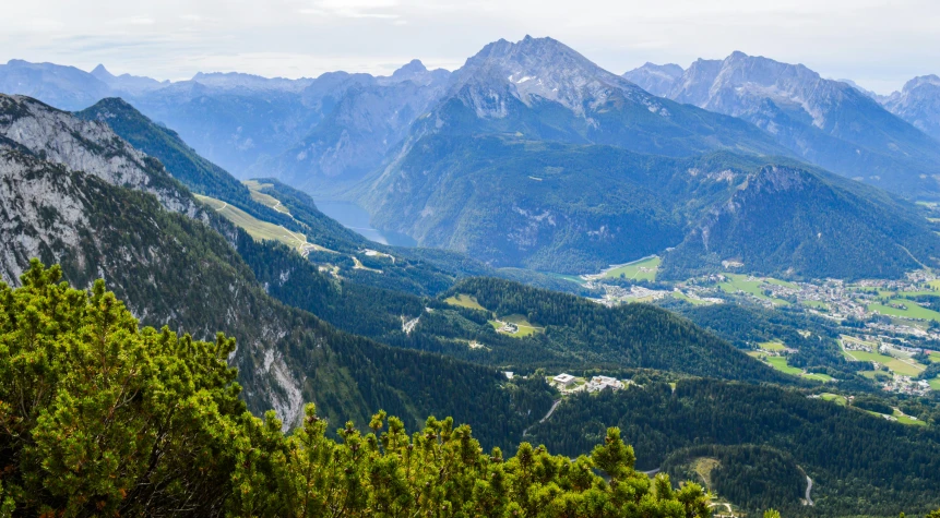 a view of a valley with mountains in the background, by Sebastian Spreng, pexels contest winner, green valley below, high elevation, thumbnail, sound of music