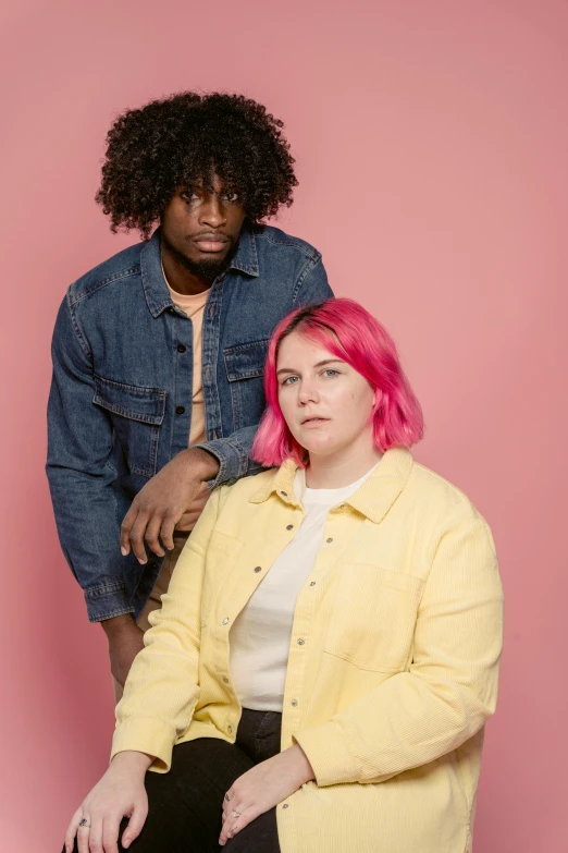 a man and a woman sitting next to each other, an album cover, trending on unsplash, portrait of a pink gang, studio shoot, lush, rhys lee