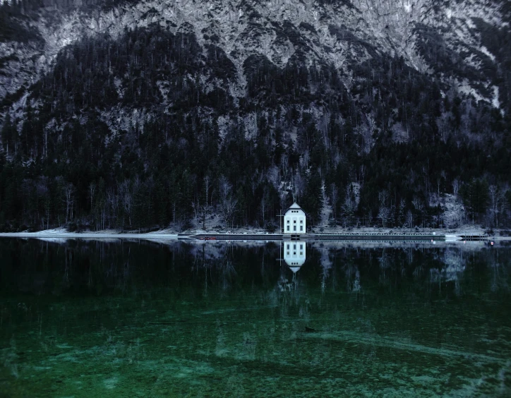 a small white building sitting on top of a lake, by Sebastian Spreng, unsplash contest winner, dark green water, malevolent shrine, cold hues, historical photo