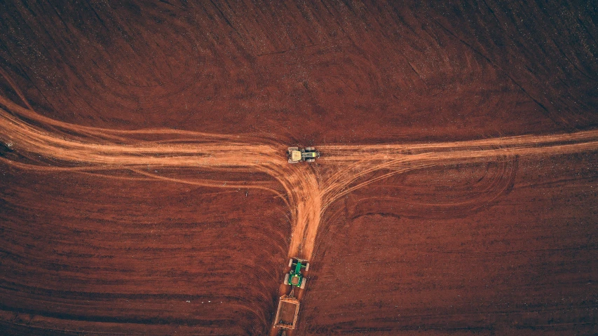 a couple of trucks driving down a dirt road, by Austin English, unsplash contest winner, precisionism, crop circles, australia intricate, mining, factorio