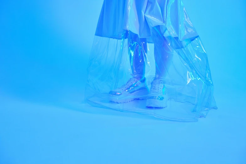 a little girl standing in a plastic bag, an album cover, inspired by Elsa Bleda, unsplash, plasticien, futuristic sneakers, blue light, ignant, cybernetic legs