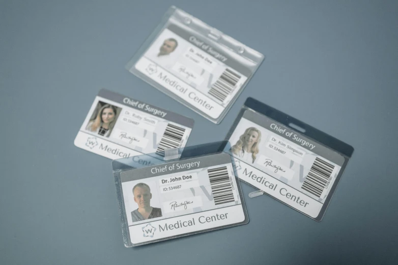 a bunch of id cards sitting on top of a table, detailed product image, surgical supplies, with two front pockets, transparent