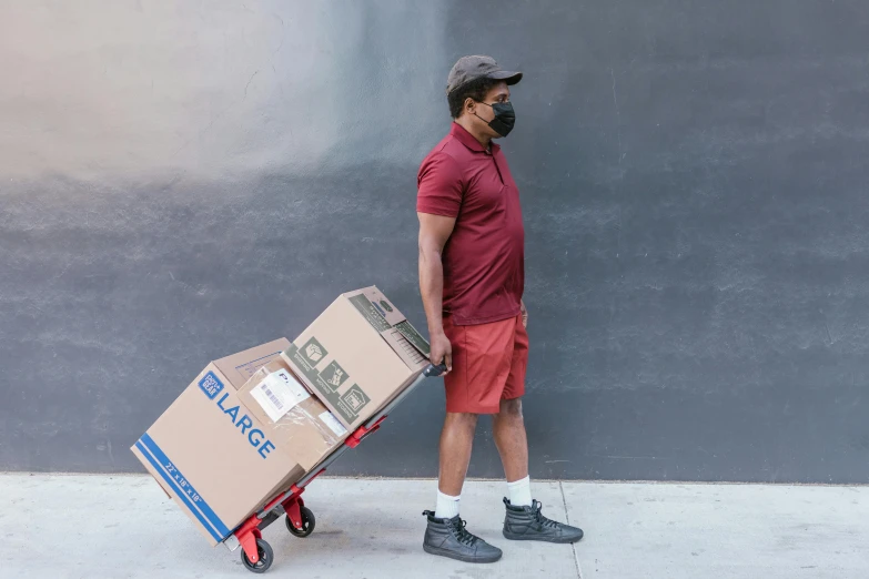 a man pushing a cart with boxes on it, by Carey Morris, pexels contest winner, renaissance, full body full height, wearing facemask, avatar image, thighs