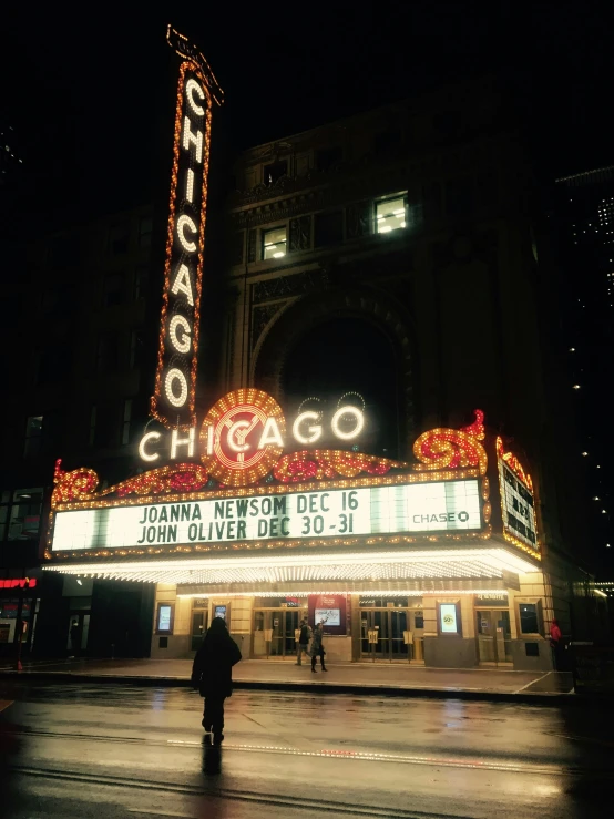the chicago theater marquee is lit up at night, by Winona Nelson, unsplash contest winner, renaissance, photo taken on fujifilm superia, college, instagram story, fall season
