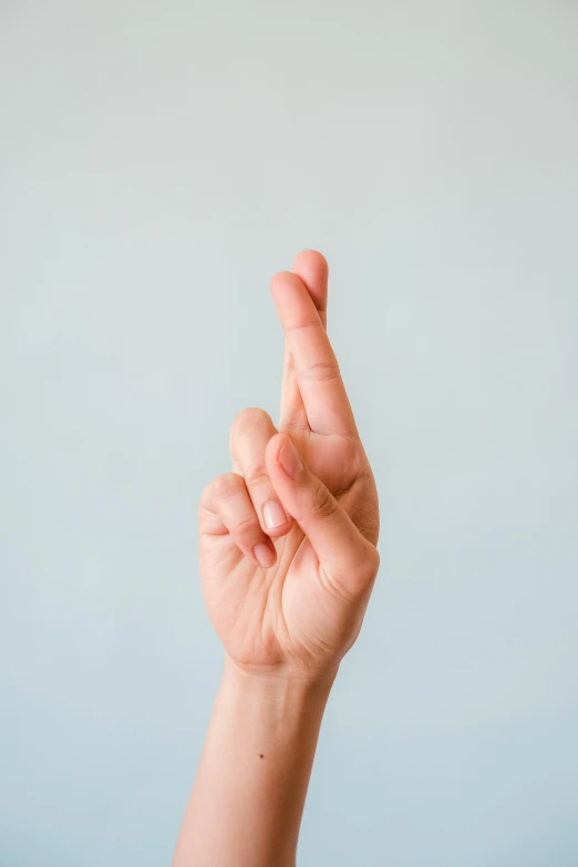 a person holding their hand up in the air, by Gavin Hamilton, pointing index finger, infinite intricacy, pick wu, close - up photograph