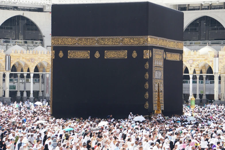 a crowd of people standing around a black building, a picture, shutterstock, hurufiyya, mecca, 2 5 6 x 2 5 6, contain, podium