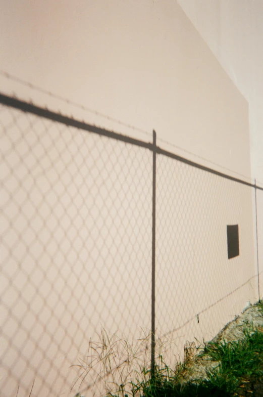 a man flying through the air while riding a skateboard, an album cover, inspired by Elsa Bleda, unsplash, photorealism, fence line, los angeles 2 0 1 5, very sparse detail, wall ]