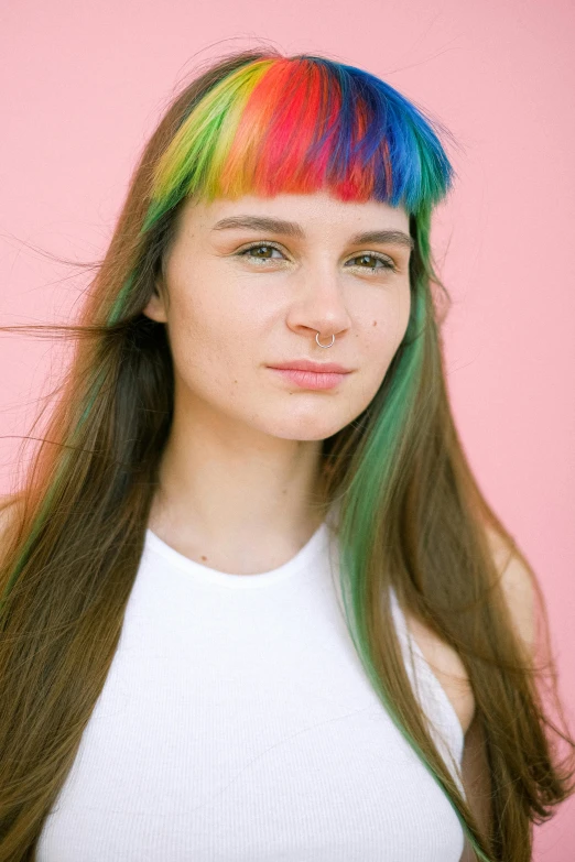 a woman with colorful hair posing for a picture, an album cover, by Julia Pishtar, trending on pexels, hipster hair fringe, 1 6 years old, h3h3, portrait of sanna marin