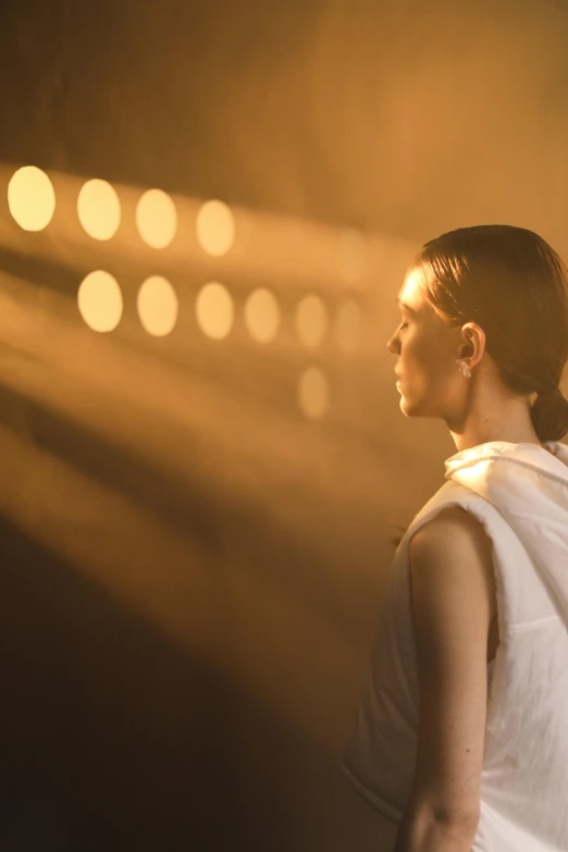 a woman that is standing in the dark, a portrait, unsplash contest winner, light and space, movie still from bladerunner, on the runway, hammershøi, beautiful lighting uhd