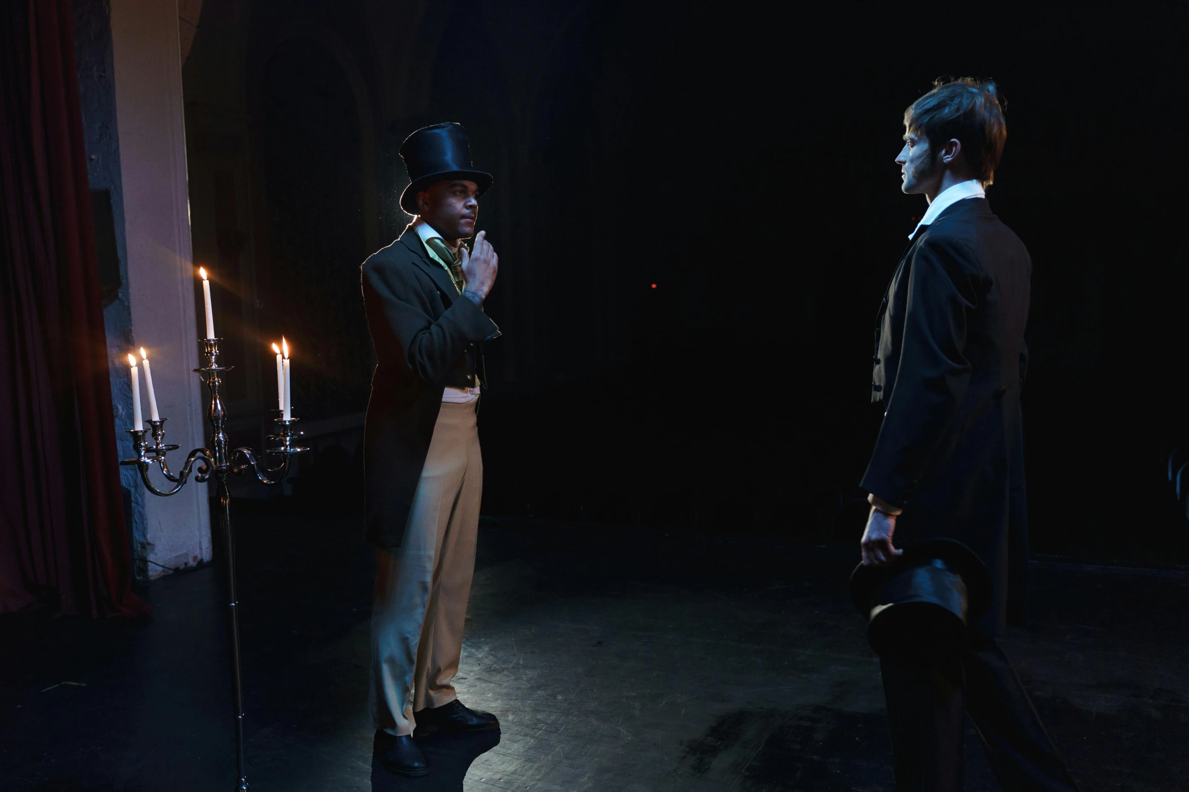 a couple of men standing next to each other on a stage, inspired by Horace Vernet, unsplash, romanticism, candle lighting, victorian clothing, 2 0 2 1 cinematic 4 k framegrab, kara walker