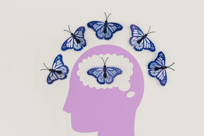 a person's head with butterflies flying out of it, an illustration of, trending on pexels, nootropic stimulant, purple colour scheme, trapped egos in physical reality, but minimalist