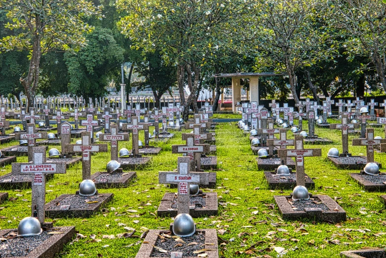 a cemetery filled with lots of tombstones and trees, a colorized photo, by Alexander Fedosav, vietnam, fan favorite, :10 gas grenades, lawn