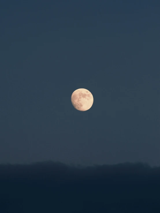 a full moon in the sky with mountains in the background, by Attila Meszlenyi, trending on unsplash, 2 0 0 mm telephoto, ☁🌪🌙👩🏾, natural morning light, taken in the early 2020s