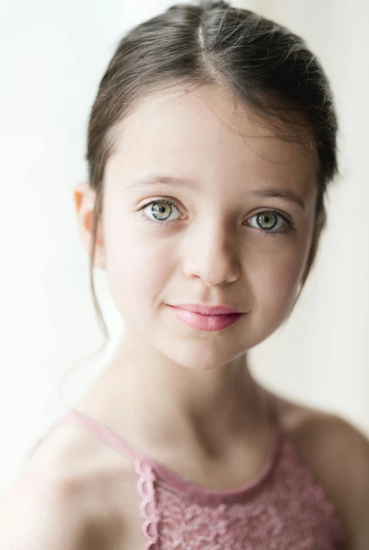 a young girl in a pink dress posing for a picture, a character portrait, inspired by Elizabeth Polunin, pexels contest winner, ultrarealistic uhd faces, acting headshot, ballet dancer, light green tone beautiful face