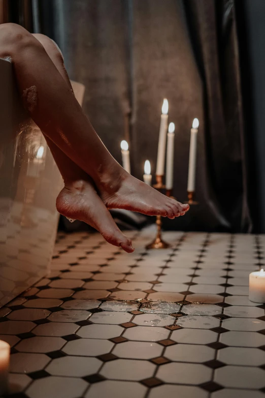 a woman is sitting in a bathtub with candles, trending on unsplash, baroque, walking down, barefoot, celebration, floating in mid - air