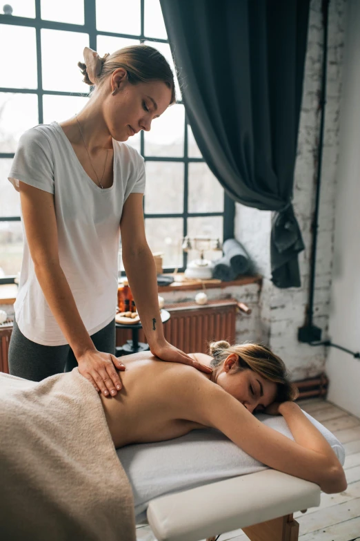 a woman getting a back massage at a spa, by Niko Henrichon, thumbnail, high quality upload, single body, unique design